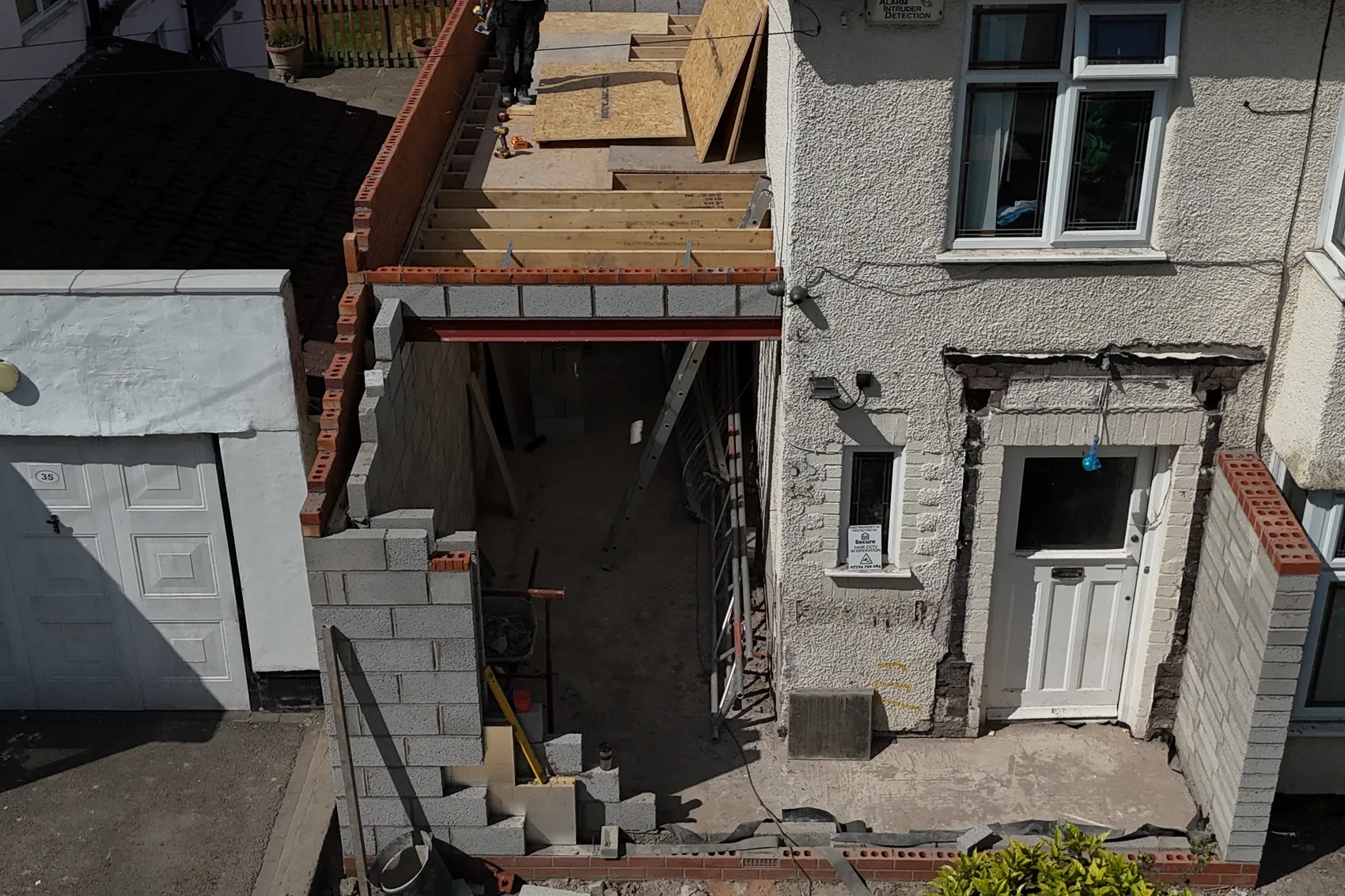 Aerial view of a property stripped out and opened up during insurance reinstatement works, with scaffold in place.