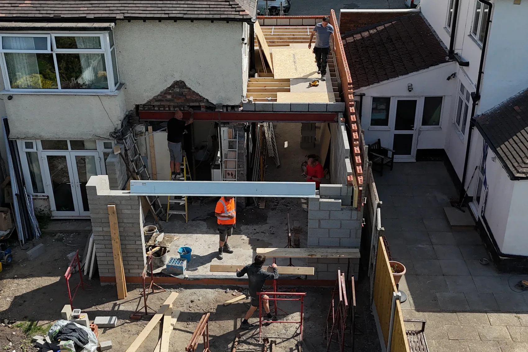 Structural frame and propping in place during reinstatement works, with waste segregated on site.