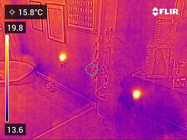 Thermal image showing a temperature difference across a wall used to trace moisture.